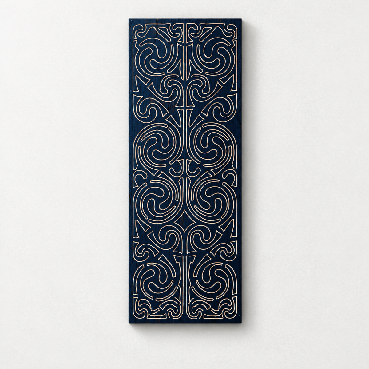 Wooden Carved Wall Hanging, Wall Art — front view on a light grey-white wall with a natural shadow